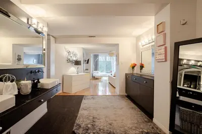 a large bathroom with a sink and a mirror at Majestic Villa in Downtown Griffintown in Montréal