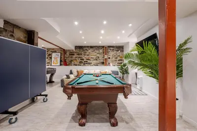 a living room with a pool table in it at Majestic Villa in Downtown Griffintown in Montréal