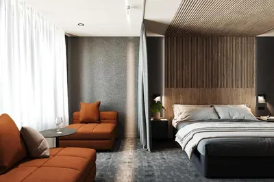 a bedroom with a bed and a couch and a chair at SonoLux in Montréal