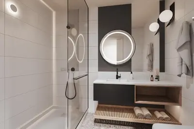 a bathroom with a shower and a sink and a mirror at SonoLux in Montréal