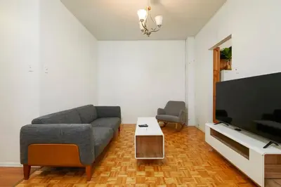 a living room with a couch and a flat screen tv at Beautiful apartment in Downtown in Montréal