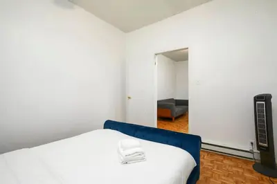 a room with a bed and a tv in it at Beautiful apartment in Downtown in Montréal