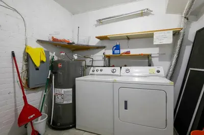 a kitchen with a stove and a washer at Beautiful apartment in Downtown in Montréal