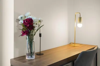 a vase of flowers sitting on a table at Magnificent 4BR in Downtown Mont-Royal in Montréal