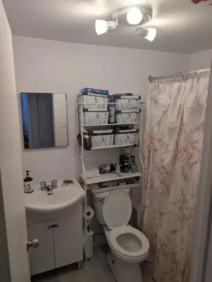 a bathroom with a toilet and a sink at Chez Walid in Montréal