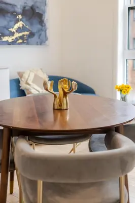 a wooden table with two chairs around a dining room table at Peaceful 1BR Getaway Near MTL Village in Montréal