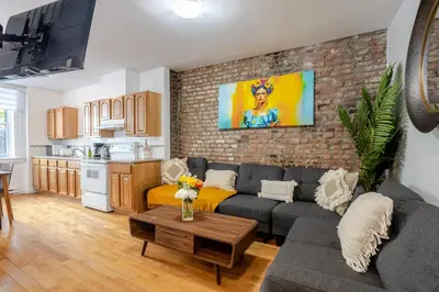 a living room with a couch and a table at Elegant 4 Bedroom residence in downtown MTL in Montréal