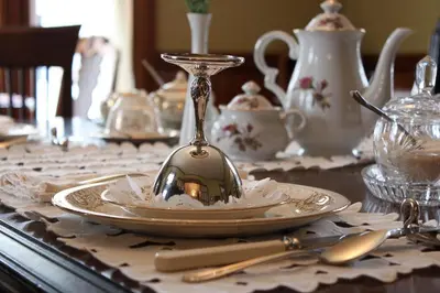 a table topped with a plate with a spoon on top at À L'Ancestrale B&B in Magog-Orford