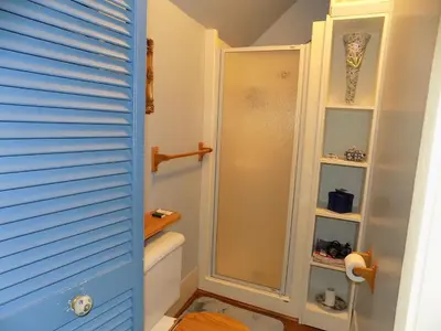 a bathroom with a shower and a toilet at À L'Ancestrale B&B in Magog-Orford