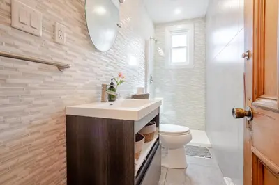 a bathroom with a sink and a toilet at 3BDR Penthouse, Rooftop and BBQ in Crescent in Montréal