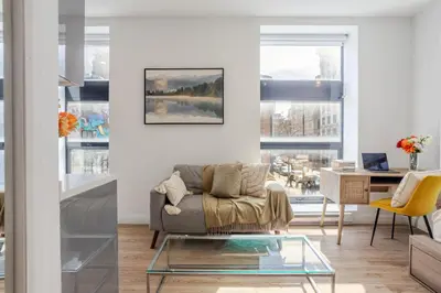 a living room with a couch and a table at Urban Studio on Bishop Hot Spot Dtown MTL in Montréal