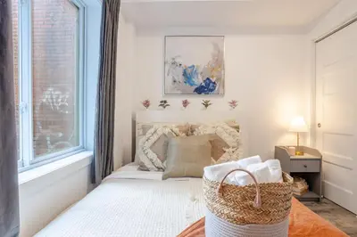 a bedroom with a bed and a window at Urban 1BDR Apartment on Bishop -MTL Live Spot in Montréal