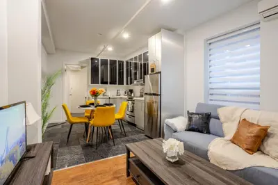 a living room with a couch and a table at Charming 1BDR Apartment on Bishop St- MTL in Montréal