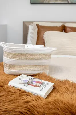 a pair of glasses and a book on a table next to a bed at 1BDR Mezzanine-Bishop-Vibe Central MTL in Montréal