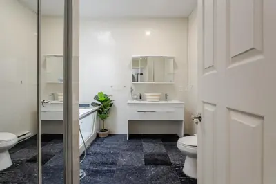 a bathroom with a toilet and a sink at Central 1BDR Apartment on Bishop Central MTL in Montréal