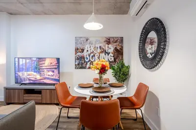 a dining room with a table and chairs at Cute 1BDR Apt in Ste-Catherine - MTL Live Spot in Montréal