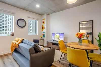 a living room with a couch and a table at Modern 1BR in downtown in Montréal