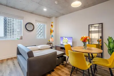 a living room with a couch and a table at Modern 1BR in downtown in Montréal