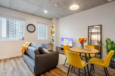 a living room with a couch and a table at Modern 1BR in downtown in Montréal