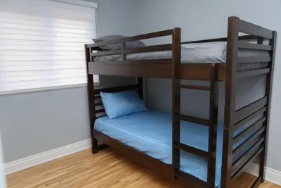a couple of bunk beds in a room at Luxieux Appartement laval in Laval