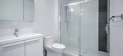 a bathroom with a shower and a toilet and a sink at INCh in Montréal