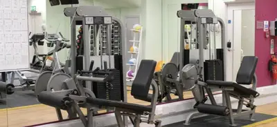 a gym with several tread machines in a room at INCh in Montréal