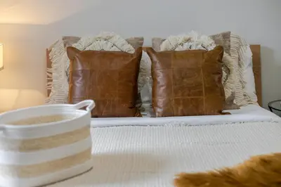 a bed with two pillows and a bowl on it at Cute Studio on Bishop - Hot Spot Dtown MTL in Montréal