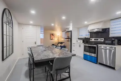 a kitchen with a table and chairs in a room at Stylish 4BR in the heart of Plateau Montreal in Montréal