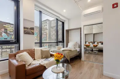 a living room with a couch and a table at Apartment MTL Dtown Spotlight MTL in Montréal