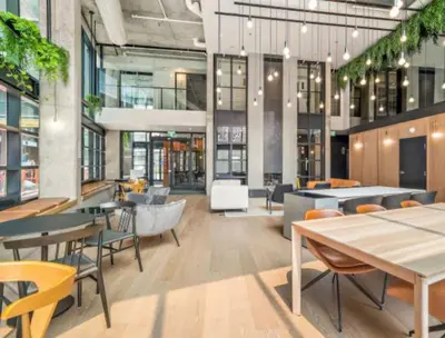 a restaurant with tables and chairs in a building at Relaxing 2 bedrooms Spa in Montréal