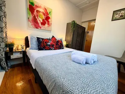 a bedroom with a bed with two towels on it at City Lights Loft-Free Parking-Sleep 18 in Montréal