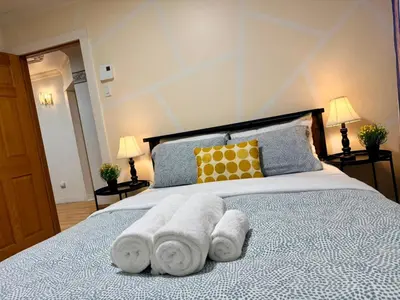 a bedroom with a bed with towels on it at City Lights Loft-Free Parking-Sleep 18 in Montréal