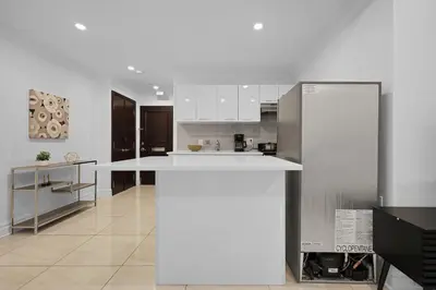 a kitchen with a white counter top in a room at Sophisticated Two Bedroom Hideaway in Westmount in Montréal
