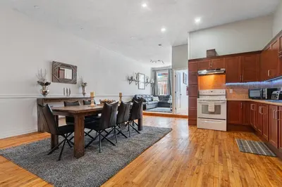 a kitchen and dining room with a table and chairs at Trendy 2BR Getaway in Montreal in Montréal