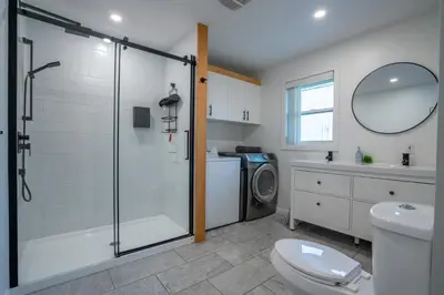 a bathroom with a shower and a toilet and a sink at Chalet des Oiseaux Bleus, Spa, Lac in Saint-Gérard