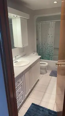 a bathroom with a sink and a toilet at Private bedroom in Montréal