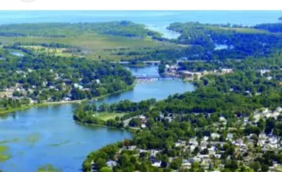 an aerial view of a river with houses and trees at Luxury bungalow in Châteauguay