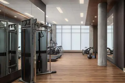 a gym with treadmills and exercise equipment in a building at Staybridge Suites Montreal Airport - St-Laurent by IHG in Montréal