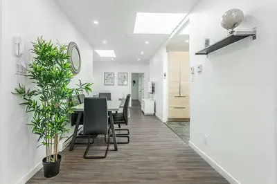 a dining room with a table and chairs at Modern 3 bedroom condo in Montréal