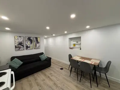 a living room with a couch and a table at Bedford 2 in Montréal