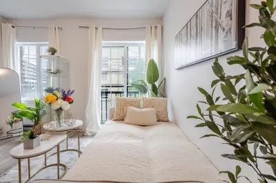 a living room with a couch and a table at Fashionable 3BR in Griffintown in Montréal