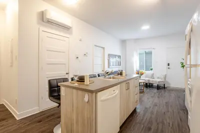 a kitchen with a sink and a counter at Modern Apartment in the Heart of Griffintown in Montréal
