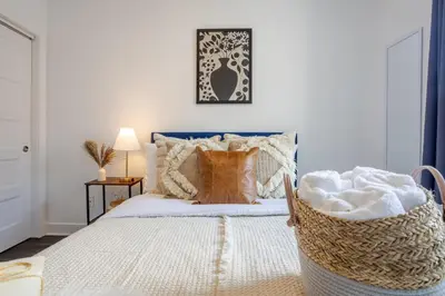 a bedroom with a bed with a basket on it at Wonderful 4 BR Home in the heart of Downtown in Montréal