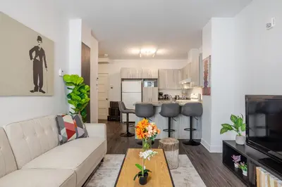 a living room with a couch and a table at Wonderful 4 BR Home in the heart of Downtown in Montréal
