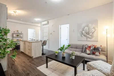 a living room with a couch and a table at Luxurious 4 BR Suite in Griffintown in Montréal