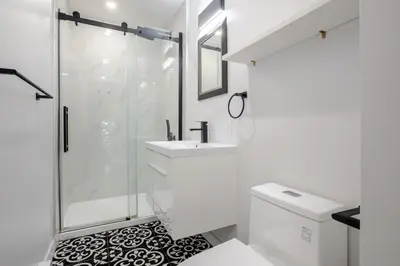 a bathroom with a shower and a sink and a toilet at The Perfect Downtown Hideaway in Montréal