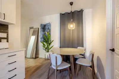 a dining room with a table and chairs at The Perfect Downtown Hideaway in Montréal