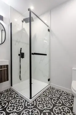 a shower with a glass door in a bathroom at Stunning 3BR on in Plateau Mont-Royal in Montréal