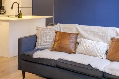 a couch with pillows on it in a kitchen at Amazing 3-Bedroom on Saint-Urbain in Montréal