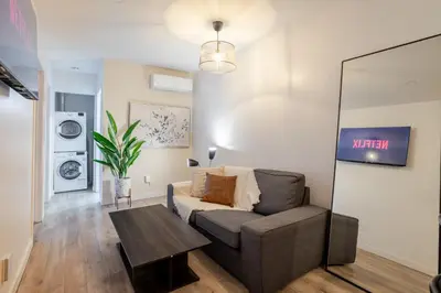 a living room with a couch and a table at Beautiful 3BR in MTL Mont-Royal in Montréal